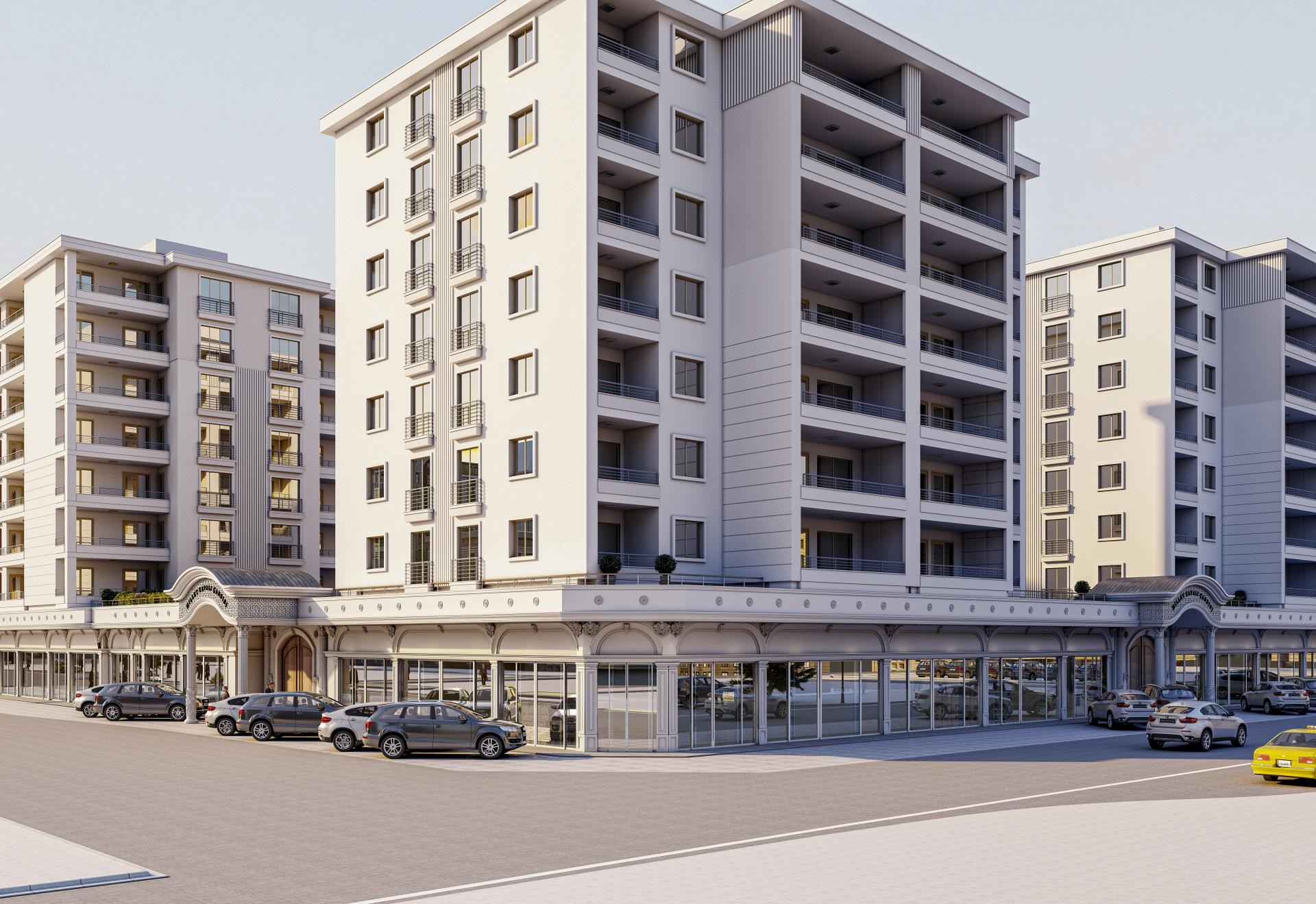 Toplu konut ve çarşı kompleksinin dış cephesinde dükkan vitrin silmeleri, kemerli giriş takları ve pencere söveleri.