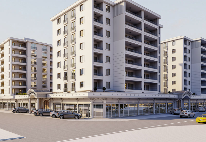 Toplu konut ve çarşı kompleksinin dış cephesinde dükkan vitrin silmeleri, kemerli giriş takları ve pencere söveleri.