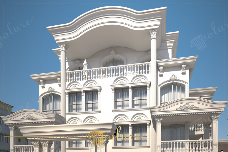Çok katlı barok binanın dış cephesinde oymalı pencere taç söveleri, balustrat korkuluklar ve dalgalı çatı canopy detayı.