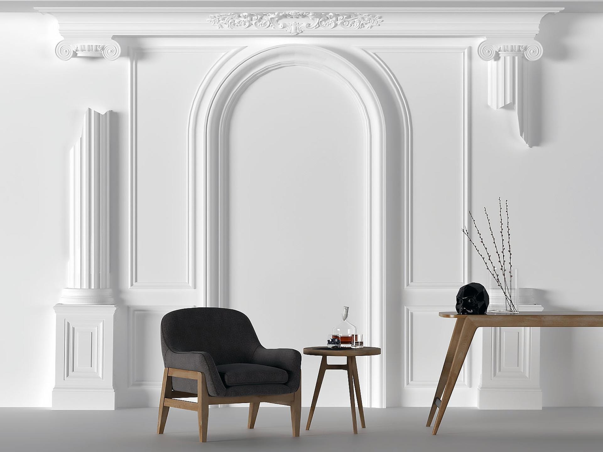 Beyaz neoklasik duvar çıtalı, kemer söveli ve sütun başlıklı duvarda koyu gri koltuklu modern salon dekorasyonu