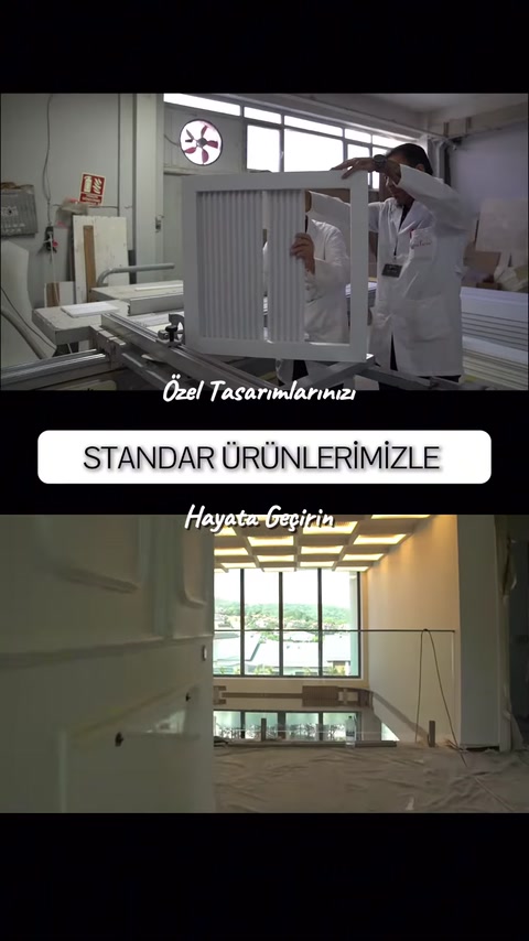 Izgaralı armatür paneli dikey konumda iki kişiyle taşınıyor
